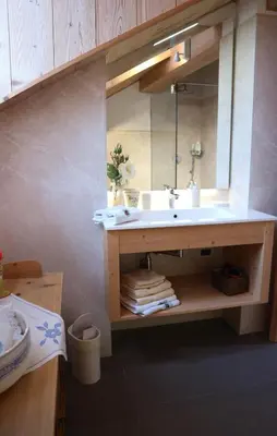 a bathroom with a sink and a mirror at B&B Casa Riz in Castello di Fiemme