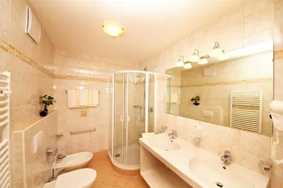 a bathroom with a toilet and a sink and a shower at Residence Tauber in Valles