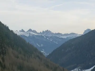 a view of a mountain valley with snow capped mountains at Residence Tauber in Valles