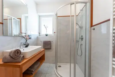 a bathroom with a sink and a shower at Feldhof Schenna in Schenna