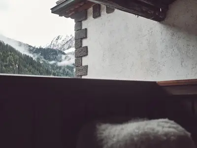 a bedroom with two beds and a window at B&B Mia Majon in Canazei