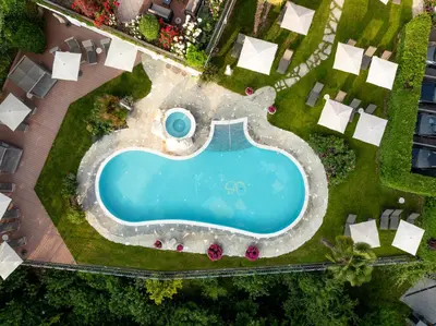 an overhead view of a swimming pool in a yard at Hotel Starkenberg in Schenna