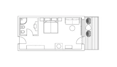a floor plan of a small apartment with furniture at Saltus in San Genesio Atesino