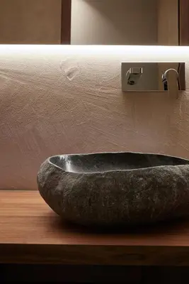 a stone sink on a counter in a bathroom at Saltus in San Genesio Atesino