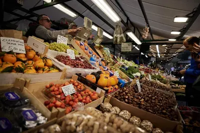 a market with many boxes of fruits and vegetables at Saltus in San Genesio Atesino