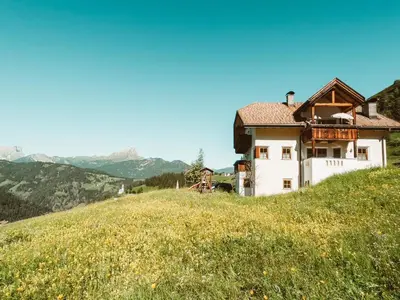 a house on top of a snow covered mountain at Apartment Fedares in La Valle