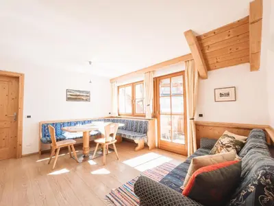 a living room with a couch and a table at Apartment Fedares in La Valle