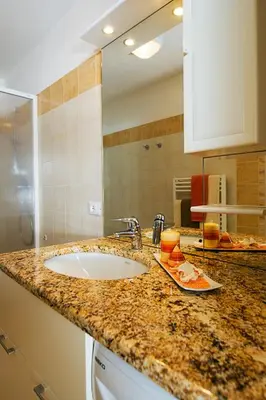 a bathroom with a shower and a sink and a toilet at Majon Vajolet - Apartments Luisa in Vigo di Fassa