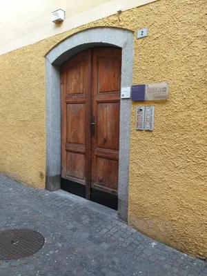 a wooden door in the side of a building at Soliman in Bressanone