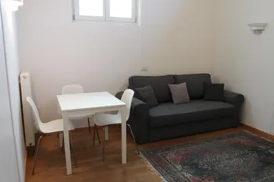 a living room with a couch and a table at Soliman in Bressanone