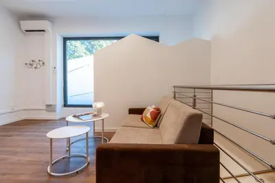 a living room with a couch and a table at Gasthof Hanni in Merano