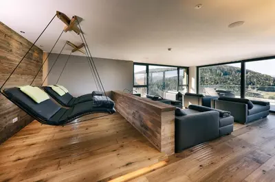 a living room with a swing in a house at Hotel Avelina in Avelengo