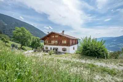 a house sitting on top of a hill at Nussbaumerhof in Bressanone