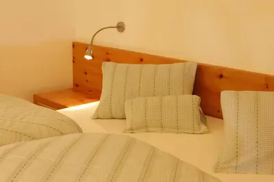 a bedroom with a bed and a flat screen tv at Hotel Stefaner in Tires