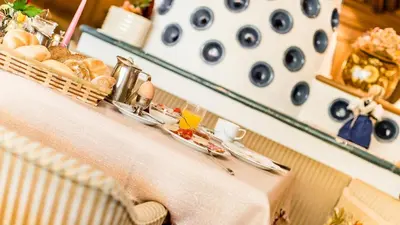 a table with a basket of bread on it at Hotel Stefaner in Tires