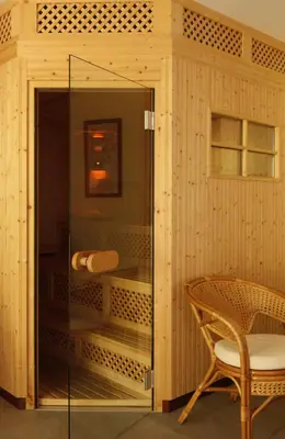 a hotel room with a bed and a headboard at Hotel Stefaner in Tires