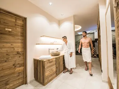 two men standing at a counter in a bathroom at Apartment Sella in Siusi