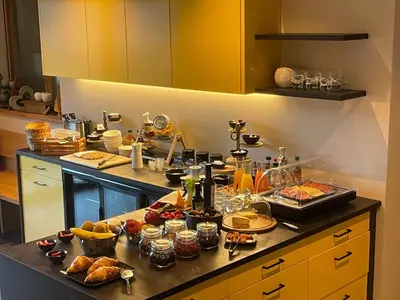 a long table filled with different types of food at Garden-Suite Faselehof in Marlengo