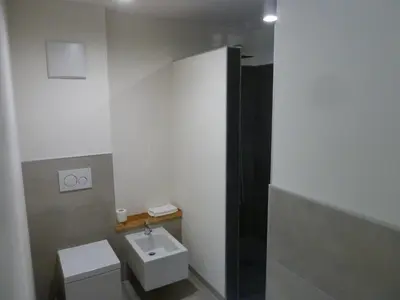 a bathroom with a toilet and a sink at Casa Lassù in Carano