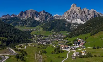 an aerial view of a village in the mountains at Nei Y Suredl NeveSole in Corvara in Badia