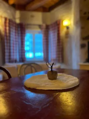 a wooden table with a small apple on top of it at Castel Madonna in San Martino di Castrozza