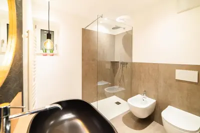 a bathroom with a sink and a toilet at Marlingsuites - Vinea - Wieser Josef - Marling in Marlengo
