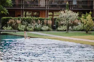 a person in the water in a swimming pool at VillaVerde Aparthotel in Lagundo