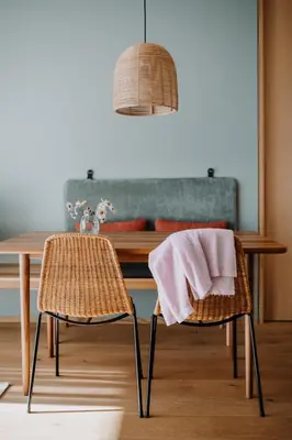 a dining room table with two chairs with a towel on them at VillaVerde Aparthotel in Lagundo