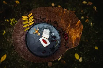 a plate of food on top of a wooden table at Hotel Fines in Funes