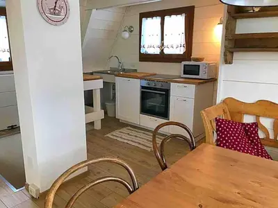 a dining room with a large wooden table and chairs at Chalet Paoletta - Alpe Cermis in Cavalese