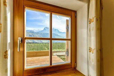 a window in a room with a view of a mountain at Gasserhof in Barbiano