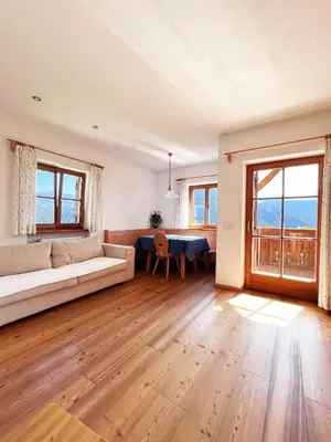 a living room with a couch and a table at Gasserhof in Barbiano