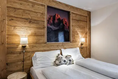 a hotel room with a bed and a window at Hotel Rio Bianco in Panchia