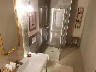 a bathroom with a shower and a white sink at Ihr neuer Lieblingsplatz in Meran in Merano