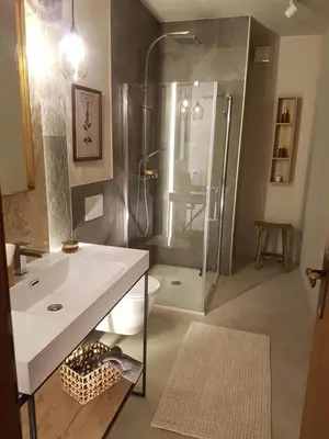 a bathroom with a shower and a sink and a toilet at Ihr neuer Lieblingsplatz in Meran in Merano