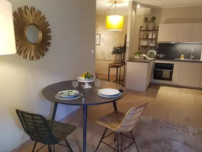 a dining room table and chairs in a kitchen at Ihr neuer Lieblingsplatz in Meran in Merano
