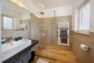 a bathroom with a sink and a shower at Landhaus Weger in Merano