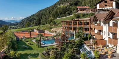 an aerial view of a hotel with a resort at Hotel Sonnenalm in Saltusio