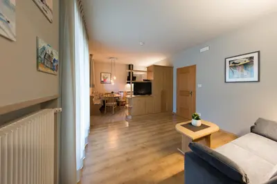 a living room with a couch and a table at Residence Neuhäuslhof in Merano