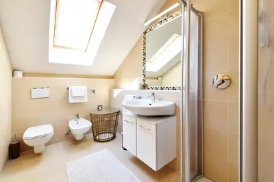 a bathroom with a sink toilet and a mirror at Castel Campan in Bressanone
