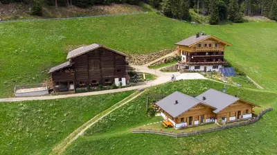 an aerial view of a house and a barn at Chalet Niederhaushof in Ultimo