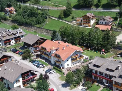 an overhead view of a house in a village at Hotel Residence Olympia in Sarntal