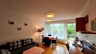 a living room with a couch and a table at Residence Atlantic in Merano