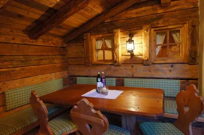 an overhead view of a dining room in a log cabin at Appartamenti La Munt in Badia
