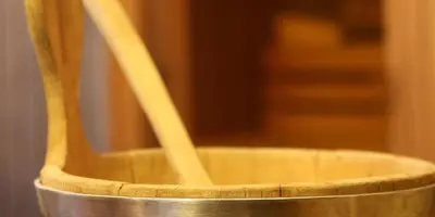 two wooden chopsticks sitting in a metal container at Hotel la Plaza in Corvara in Badia