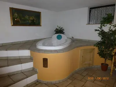 a bathroom with a bath tub in a room at Hotel San Giovanni in Vigo di Fassa