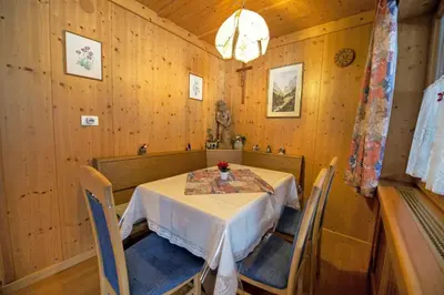 a dining room with a table and chairs at Apartment Soval in Ortisei