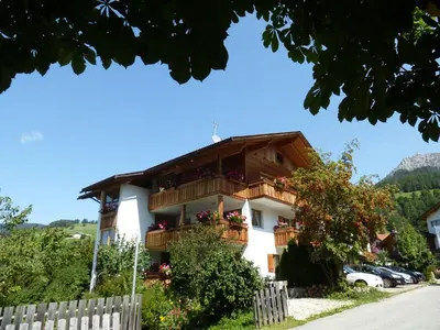 a building with balconies on the side of it at Ciasa Isidor in San Vigilio Di Marebbe