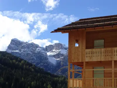 a building with a view of a mountain at Apartments Serghela in San Cassiano
