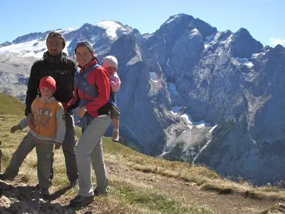 a woman and two children standing on top of a mountain at Apartments Serghela in San Cassiano